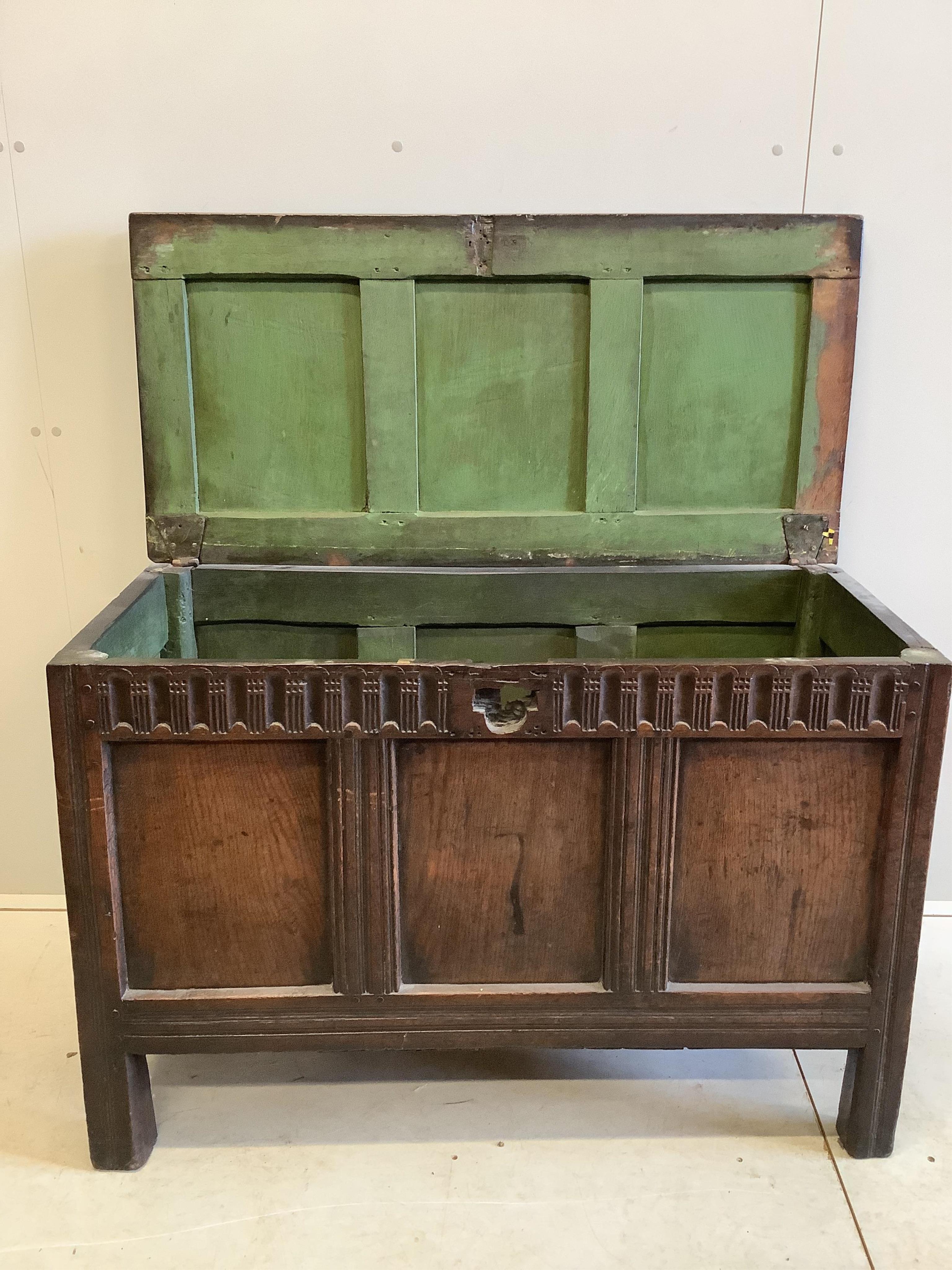 A 17th century panelled oak coffer, (damage to lock), width 111cm, depth 54cm, height 75cm. Condition - poor